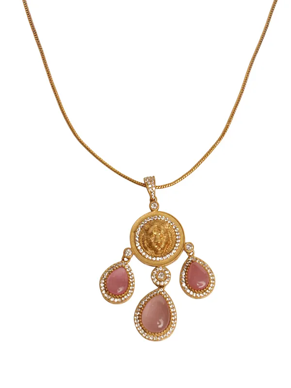 Stunning_Gold_Plated_Pendant_Set._The_top_charm_mirrors_the_gold_coin-like_emblem_With_Pink_stone.These_earrings_have_a_royal,_statement_appeal,_suitable_for_festive_or_formal_occasions.