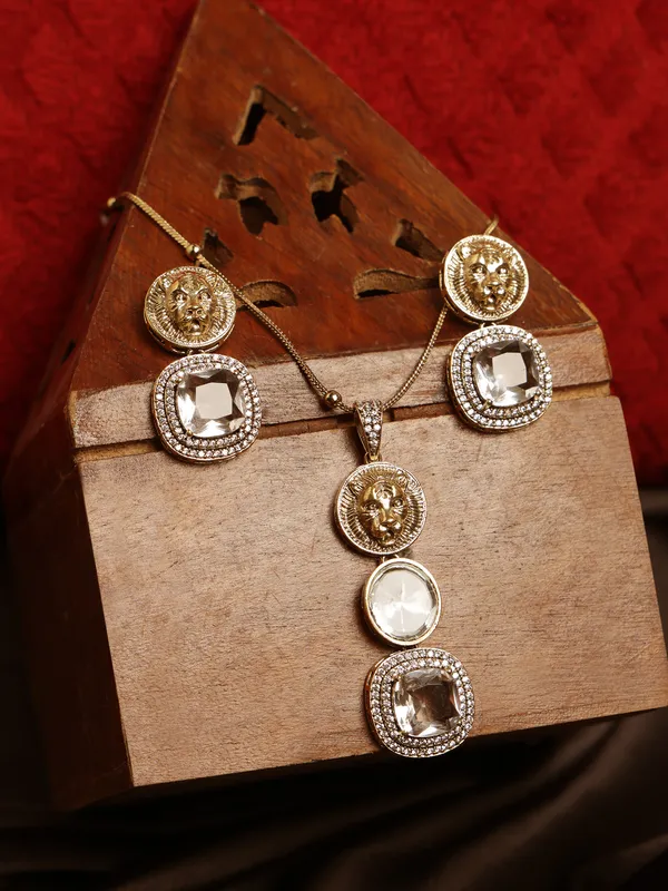 Stunning_earring_and_pendant_set_in_the_image_has_a_bold,_vintage-inspired_design_with_a_modern_twist_The_top_portion_has_a_golden,_coin-like_circular_design_with_a_lion