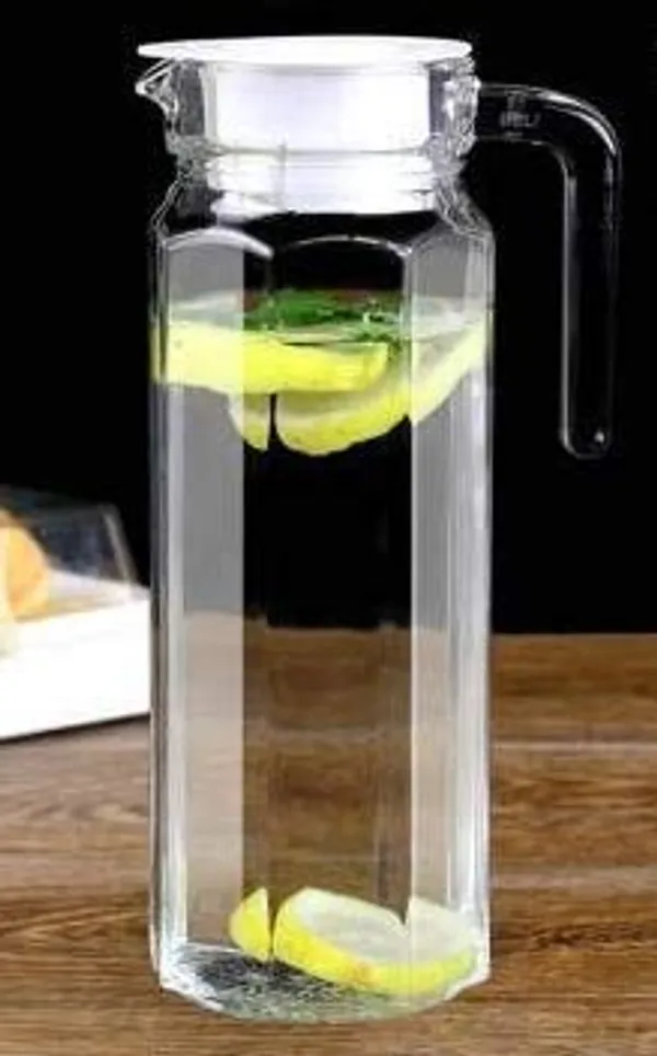 Transparent_Clear_Premium_Water_Jug_With_Plastic_Lid_&_Handle_1.1L_Beverage_Carafe_For_Home_Office_Pitcher_For_Serve_Water_Milk_Juice_Beverage_Chaas_Cocktail_(Octa_Jug_1.1_Ltr)