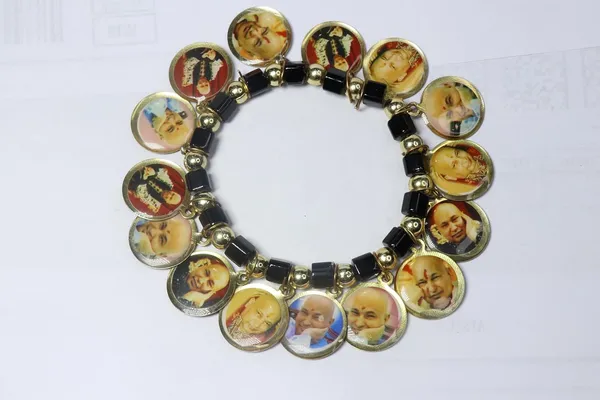 Shukrana_Blessings_Guruji_Swaroop_Bracelet_with_Shiv_Ji_Swaroop_Bracelet_–_Sacred_Round_Medallions_with_Gold-Toned_Border,_Black_Beads,_and_Golden_Accents