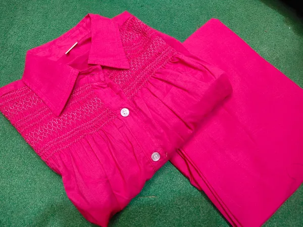 Hot_Pink_cotton_co-ord_set_with_intricate_embroidery_detailing_and_contemporary_comfort