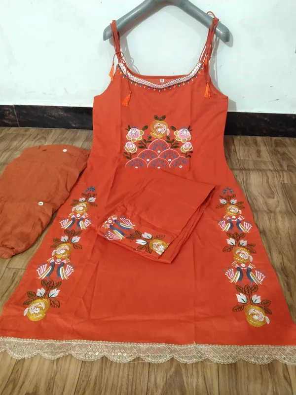 Stylish_cotton_embroidered_sleeveless_kurti_set_with_chic_festive_detailing