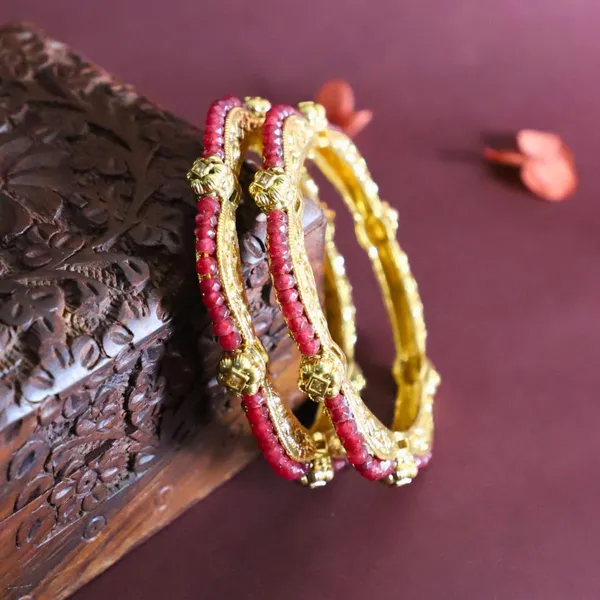 Trendisia_Gold-Plated_Designer_Bangles_with_Intricate_Carvings_&_Red_Beaded_Detailing_For_Women_&_Girls