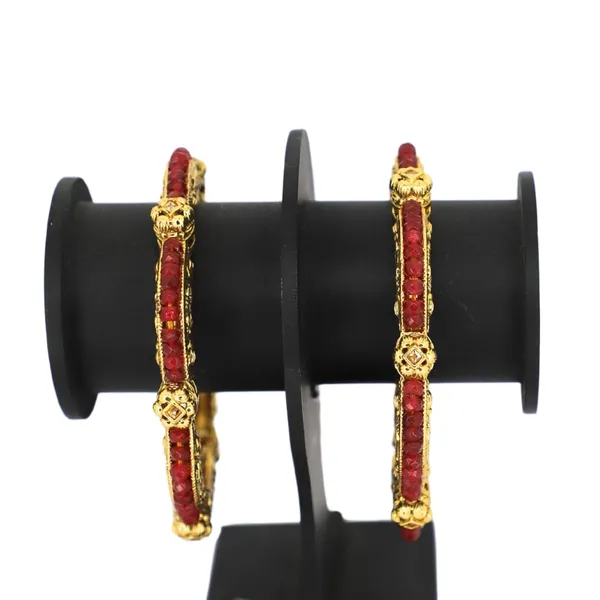 Trendisia_Gold-Plated_Designer_Bangles_with_Intricate_Carvings_&_Red_Beaded_Detailing_For_Women_&_Girls