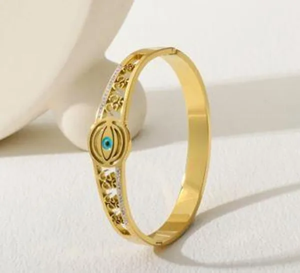 Stainless_Steel_Gold_Plated_Om_Design_Evil_Eye_Kada-_STKD_49_For_Women_&_Girls