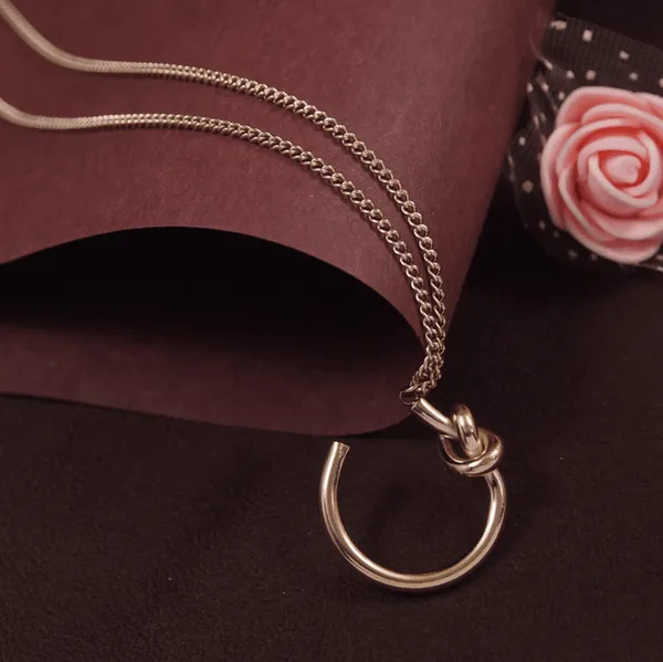 Stainless_Steel_Rosegold_Plated_Knot_Cuff_Chain_Pendant-_STN_For_Women_&_Girls