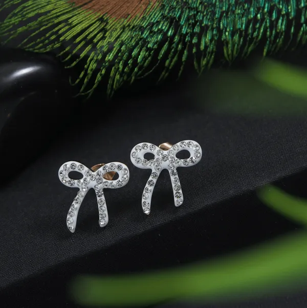 Stainless_Steel_Rosegold_Plated_White_Coloured_Bow_Shaped_Stud_Earring-STNER_2919_For_Women_&_Girls