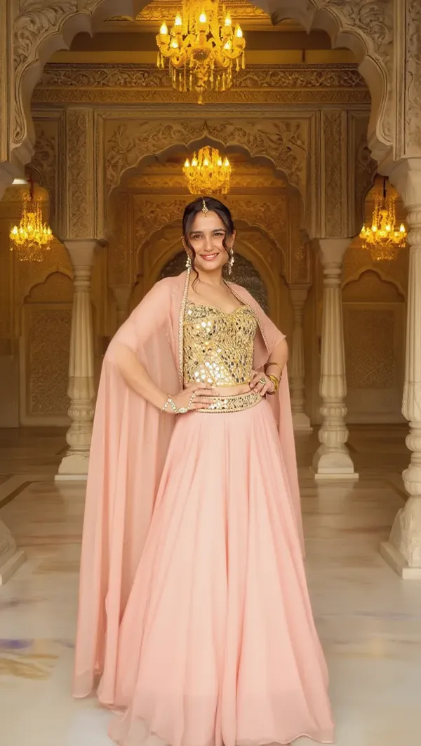 3_PIECE_HAND_EMBROIDERED_MIRROR_WORK_CORSET_BLOUSE_WITH_BABY_PINK_LEHENGA_AND_CAPE