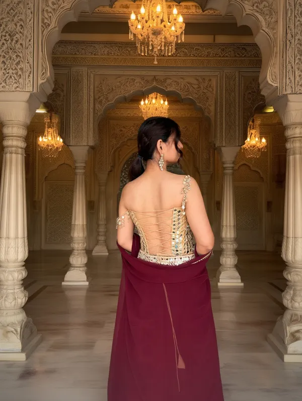 3_PIECE_HAND_EMBROIDERED_MIRROR_WORK_CORSET_BLOUSE_WITH_MAROON_LEHENGA_AND_CAPE