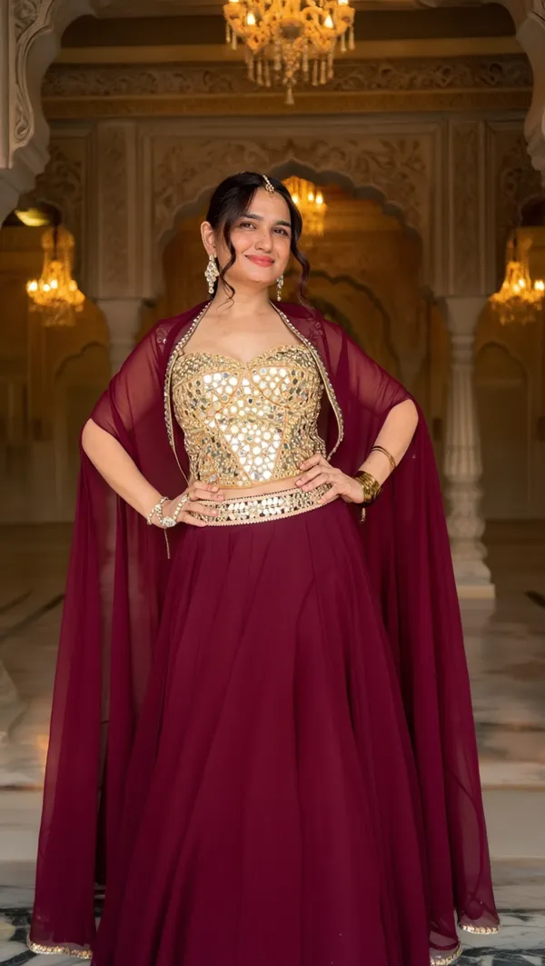 3_PIECE_HAND_EMBROIDERED_MIRROR_WORK_CORSET_BLOUSE_WITH_MAROON_LEHENGA_AND_CAPE