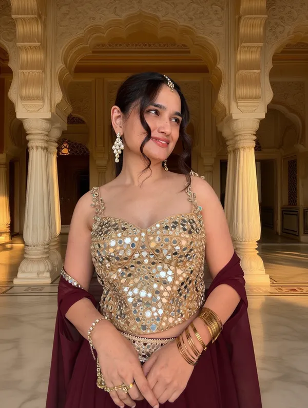 3_PIECE_HAND_EMBROIDERED_MIRROR_WORK_CORSET_BLOUSE_WITH_MAROON_LEHENGA_AND_CAPE