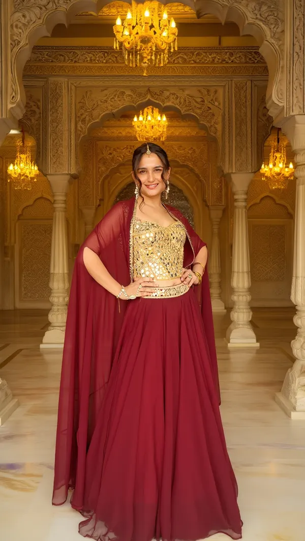 3_PIECE_HAND_EMBROIDERED_MIRROR_WORK_CORSET_BLOUSE_WITH_MAROON_LEHENGA_AND_CAPE