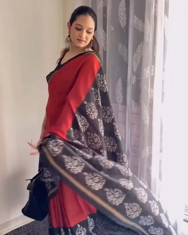 Red_Eclipse_-_Red_Linen_Saree_with_Black_Blouse_and_Black_Border