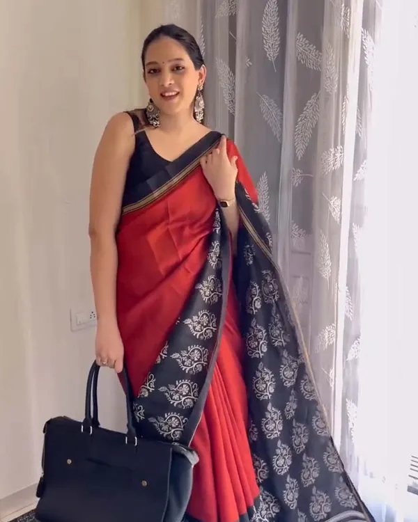 Red_Eclipse_-_Red_Linen_Saree_with_Black_Blouse_and_Black_Border