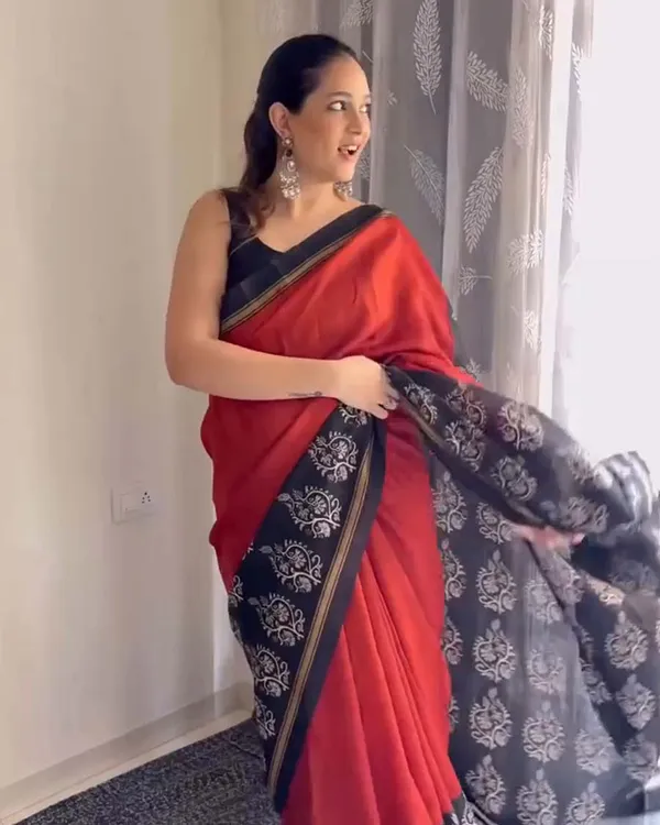 Red_Eclipse_-_Red_Linen_Saree_with_Black_Blouse_and_Black_Border