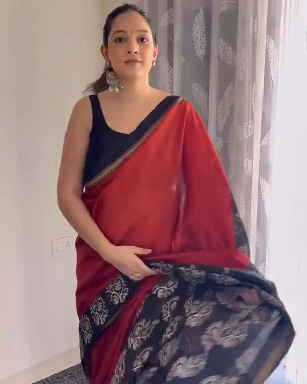Red_Eclipse_-_Red_Linen_Saree_with_Black_Blouse_and_Black_Border