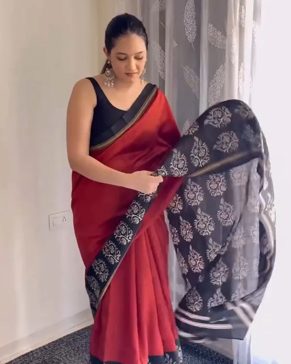 Red_Eclipse_-_Red_Linen_Saree_with_Black_Blouse_and_Black_Border