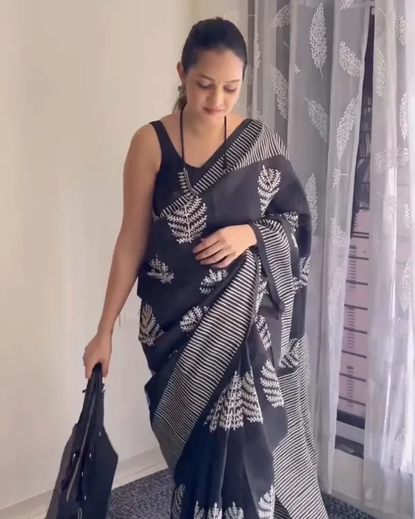 Shadow_Petals_-_Black_Linen_Saree_with_Black_Blouse_and_Floral_Accent