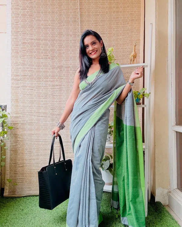 Grey_Grove_-_Grey_Linen_Saree_Drape_with_Green_Border_&_Black_Blouse