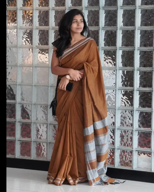 Tejas_Dhara_-_Saffron_Linen_Saree_with_Silver_Border_Design_&_Blouse_Piece