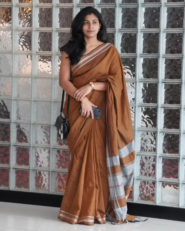 Tejas_Dhara_-_Saffron_Linen_Saree_with_Silver_Border_Design_&_Blouse_Piece