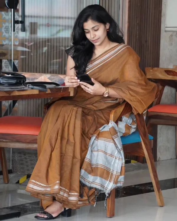 Tejas_Dhara_-_Saffron_Linen_Saree_with_Silver_Border_Design_&_Blouse_Piece