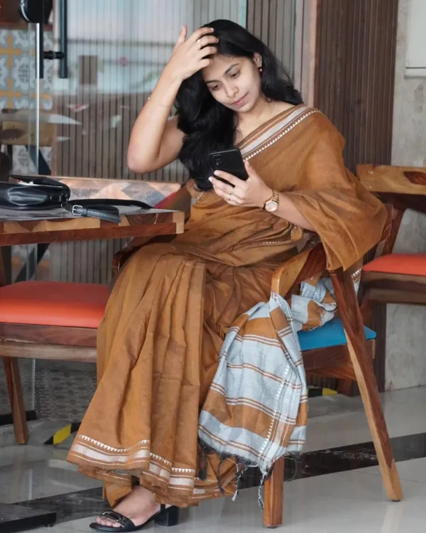 Tejas_Dhara_-_Saffron_Linen_Saree_with_Silver_Border_Design_&_Blouse_Piece