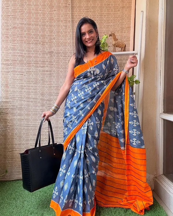 Neel_Kesari_-_Blue_Linen_Saree_with_Saffron_Edge_&_Black_Blouse
