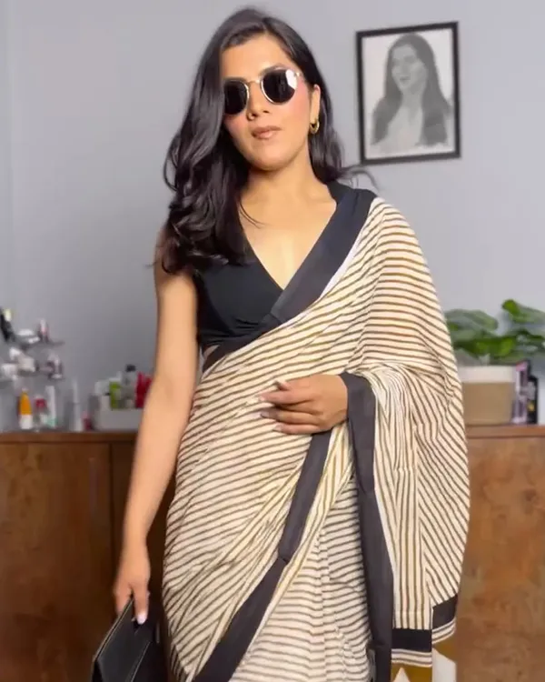 Ivory_Ink_-_Cream_Linen_Saree_with_Lining_Pattern,_Black_Border_&_Blouse