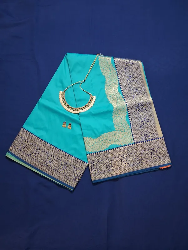 Teal_Green_&_Navy_Banarasi_Silk_Saree_With_Unstitched_Blouse