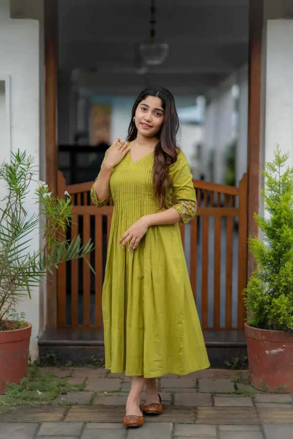 Green_Flared_Kurti_With_Embroidered_Sleeves_For_Women