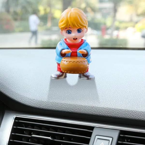 Swinging_Drummer_Boy_Dashboard_Toy_Air_Freshner_–_Moving_Head_Figurine_with_Built-in_Fragrance_Diffuser_(Yellow_&_Blue)