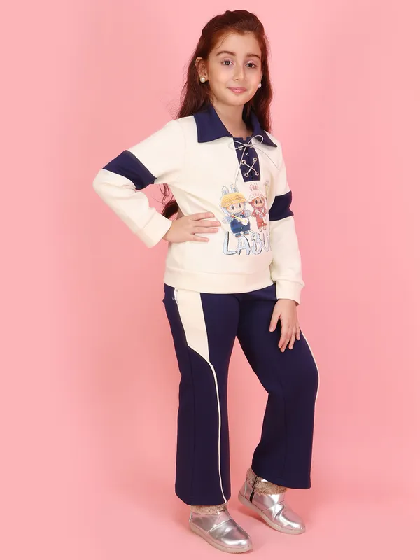 Cutecumber_Girls_Cream_&_Navy_Blue_Neoprene_Top_&_Pant_Co-Ord_Set_Graphic_&_Side_Stripe_Pants_�_Stylish_Winter_Casual_&_Travel_Wear_Outfit_for_Kids_&_Baby_Girls_(Age_1�15_Yrs)