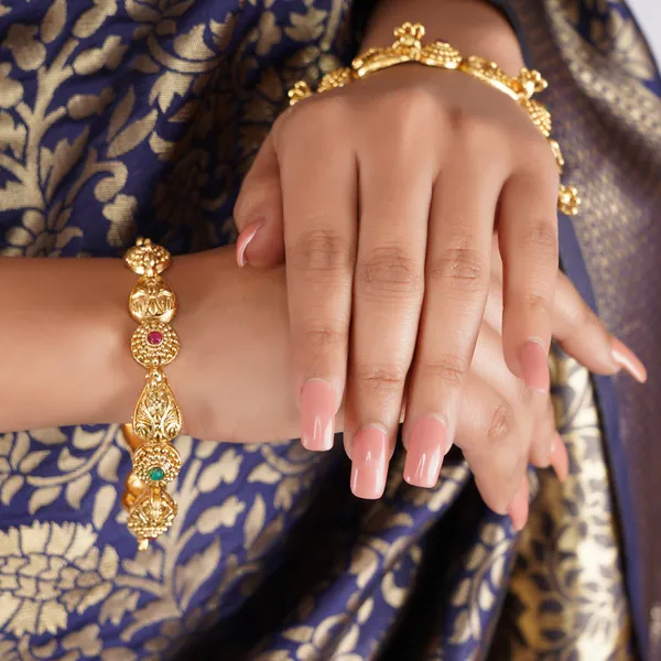 Exquisite_Gold-Toned_Bangle_Set_with_Ruby_and_Emerald_Accents