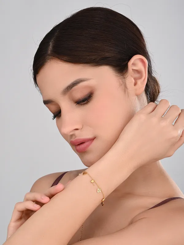 Elegant_Gold_Beaded_Bracelet_with_Geometric_Charms