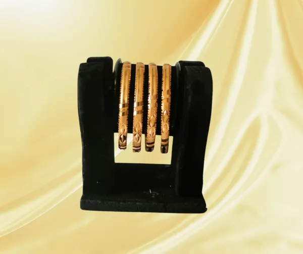 Elegant_Gold-Plated_Bangle_Set_with_Intricate_Detailing_(Set_of_4)
