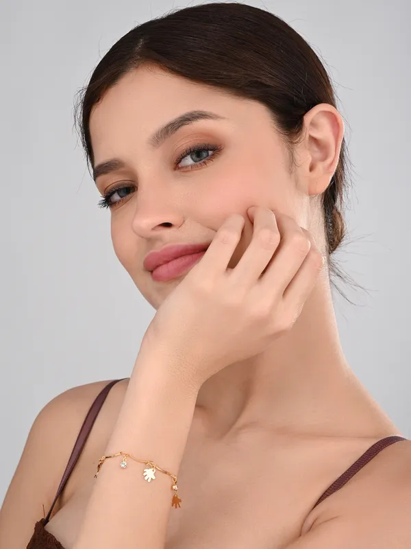 Elegant_Gold-Tone_Charm_Bracelet_with_Sparkling_Accents_and_Hand_Charms