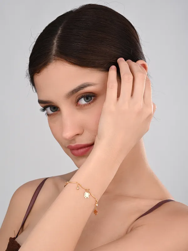 Elegant_Gold-Tone_Charm_Bracelet_with_Sparkling_Accents_and_Hand_Charms