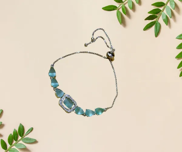 Elegant_Silver-Tone_Bolo_Bracelet_with_Soft_Green_Gemstones_and_Crystal_Accents
