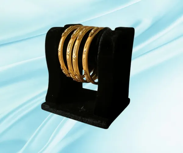 Exquisite_Gold-Plated_Bangle_Set_with_Textured_Accents_(Set_of_4)
