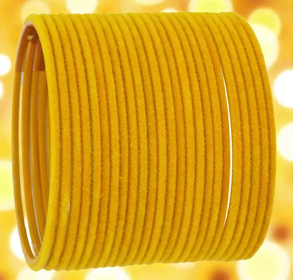 Radiant_Elegance:_Woman_in_Traditional_Saree_and_Vibrant_Yellow_Bangles