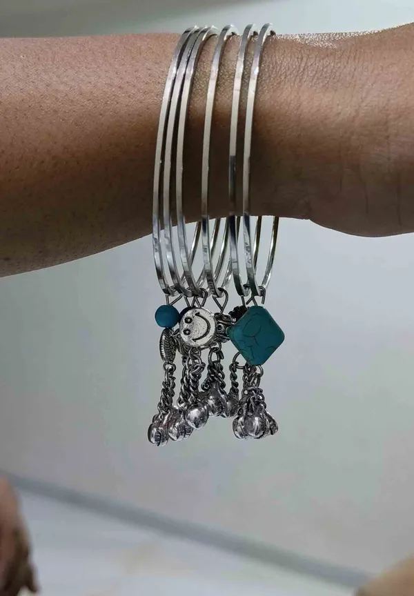Set_of_6_Oxidized_Silver_Bangles_with_Assorted_Charms___Moon,_Bird,_Heart,_and_Beads
