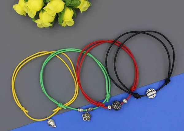Multicolor_Adjustable_Thread_Anklet_Set___Pack_of_4_with_Funky_Charms_for_Women___Girls