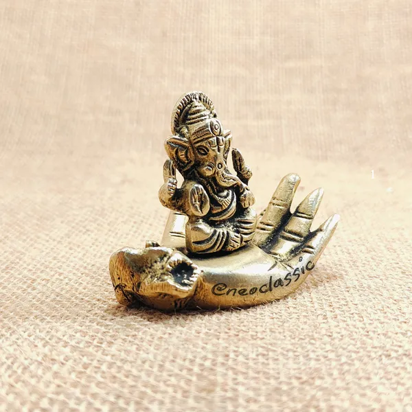 Ganesha_Idol_Sitting_on_Hand_2.2_Inch_Pure_Brass_Ganpati_Murti_Hath_Ganesh_Showpiece_for_Home_Temple,_Pooja_Decor