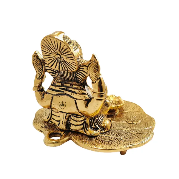 Ganesh_Idol_on_Leaf_with_Deepak_Lord_Ganesha_Metal_Handcrafted_Idol_with_Diya_Home_Decorative,_Puja,_Corporate_Spiritual_Gift_Gold_Finish