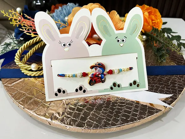 2_Pc_kids_metallic_Rakhi_with_all_Tika_essentials_for_Bhatija_bhateeji_(random_design-2_pc_only)
