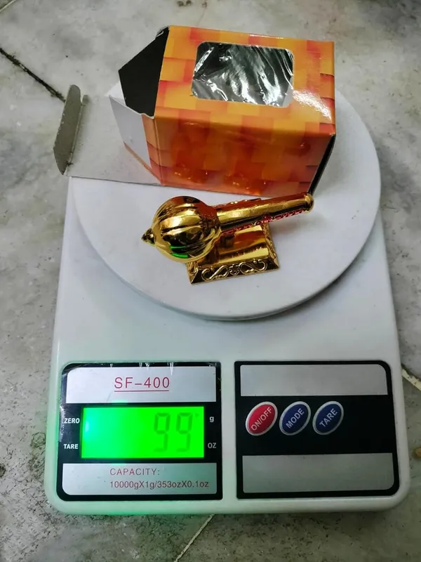 Golden_Metal_Made_Bajrang_Bali_Small_Gada_With_Big_Square_Stand_For_Keeping_In_Home_Temple_Or_Gifting_To_Hanuman_Ji_Size-_3_Inch_Wt-110_Gram_Approx