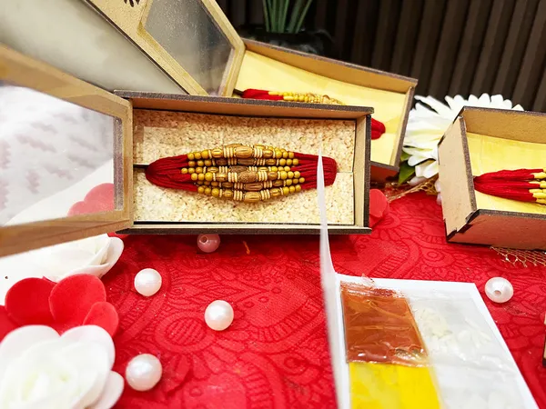 Chandan_sugandhit_Rudraksh_Rakhi_Set_of_12_Designer_Rakhi_Combo_Pack,_Rakhi_For_bhai_Bhabhi_Kids_(Random_Designs_any_one_pack_of_12_pc)_with_Tika_pack