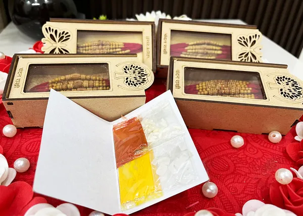 Chandan_sugandhit_Rudraksh_Rakhi_Set_of_12_Designer_Rakhi_Combo_Pack,_Rakhi_For_bhai_Bhabhi_Kids_(Random_Designs_any_one_pack_of_12_pc)_with_Tika_pack