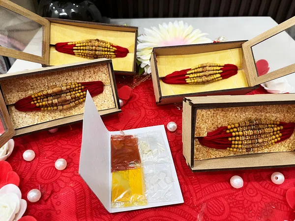 Chandan_sugandhit_Rudraksh_Rakhi_Set_of_12_Designer_Rakhi_Combo_Pack,_Rakhi_For_bhai_Bhabhi_Kids_(Random_Designs_any_one_pack_of_12_pc)_with_Tika_pack